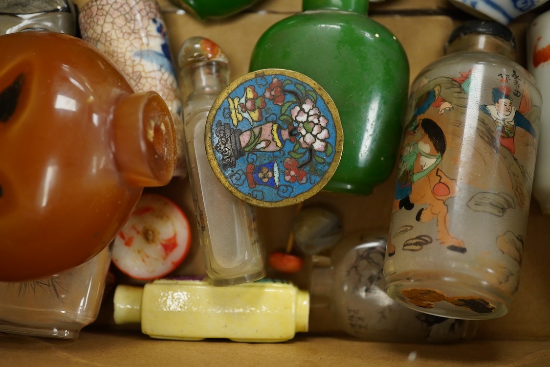 A small collection of Chinese snuff bottles, 19th century and later to include reverse glass painted examples and cinnabar lacquered examples, largest 9.5cm high